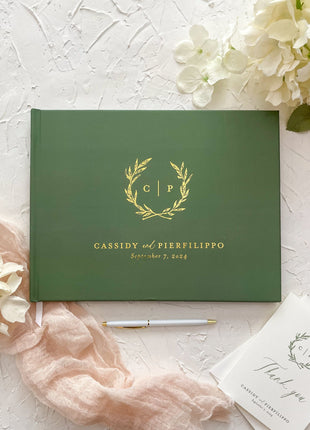 Green guestbook with olive branches for Italian wedding